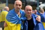 Ukrainian soldiers with national flags draped over their shoulders after returning home in Ukraine, on June 5, 2026. (Source: Coordination Headquarters for the Treatment of Prisoners of War)