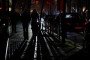 Residents walk along a darkened street during a power outage following Russian strikes on the city’s critical infrastructure. (Photo: open source)