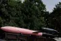 A Ukrainian-made FP-5 Flamingo cruise missile painted in pink and black sits on a launcher during a public display. (Source: TSU)