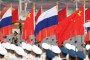 Chinese People's Liberation Army (PLA) guards hold Chinese and Russian flags. (Source: Getty Images)