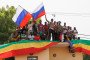 Supporters of Malian Interim President wave flags of Russia during a pro-Junta and pro-Russia rally in Bamako on May 13, 2022. (Source: Getty Images)