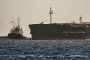 A tugboat guides the Russian oil tanker Anatoly Kolodkin as it arrives at the oil terminal in the port of Matanzas, northwestern Cuba. (Source: Getty Images)