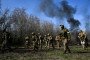 Recruits, supervised by instructors, cover a distance on Day Zero of Basic Military Training at the 118th Separate Mechanised Brigade of the Ukrainian Armed Forces on April 5, 2026. (Source: Getty Images)