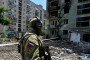 Illustrative image. A Russian soldier patrols a destroyed residential area in the Ukrainian city of Severodonetsk on July 12, 2022. (Source: Getty Images)