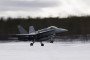 A Finnish F-18 Hornet lands at Jokkmokk Air Base during a joint exercise between the air forces of Finland and Sweden over the Arctic Circle on March 25, 2019.