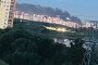Smoke rises in the distance behind residential high-rises following a reported drone strike on Moscow region overnight August 18, 2026. (Source: Exilenova+)