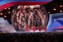 Female singer group perfrom at a Russian pro-war event as pictures of Russian military officers seen on the backgroud. (Source: Getty Images)