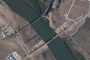 Satellite imagery displays the new road bridge built parallel to the existing rail-only Friendship Bridge across the Tumen River. (Source: The Guardian / Ukrainian human rights organization Truth Hounds)