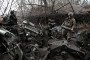 A soldier from the 44th Hetman Danylo Apostol Artillery Brigade of the Ukrainian Armed Forces holds a 155 mm shell by an M777 howitzer during a combat mission in the Dnipropetrovsk region, Ukraine. (Source: Getty Images)