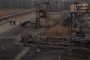 Employees walk past damaged parts of the Naftogaz gas facility, following Russian missile and drone attacks, in Ukraine, on December 2, 2025. (Source: Getty Images)