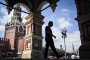 A man walks out of St. Basil's cathedral in front of the Spasskaya tower at Red Square in central Moscow. (Source: Getty Images)