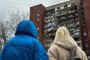People look at a damaged apartment building following a Russian drone attack on March 24, 2026 in Dnipro, Ukraine. (Source: Getty Images)