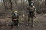 Ukrainian soldiers with the 33rd Separate Mechanized Brigade get training in case of a gas attack during military training on March 13, 2025, in Dnipropetrovsk, Ukraine. (Source: Getty Images)