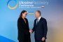 Polish Prime Minister Donald Tusk (R) shakes hands with Ukraine’s Prime Minister Yulia Svyrydenko as she arrives to attend the Ukraine Recovery Conference (URC 2026) in Gdańsk, Poland. (Source: Getty Images)