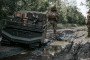 GEREON unmanned ground vehicle transporting military cargo through muddy frontline terrain in Ukraine. (Source: ARX Robotics)