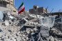 An Iranian flag is planted in the rubble of a police station, damaged in airstrikes on March 3, 2026 in Tehran, Iran. (Source: Getty Images)