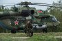 A Belarusian soldier guards a helicopter at the Asipovichy military training ground during the Zapad 2017 military exercises on September 18, 2017 in in Asipovichy, Belarus. (Source: Getty Images)