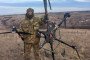 Russian soldier standing with downed Ukrainian Vampire heavy bomber drone.