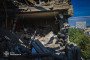 Rescue workers inspect the heavily damaged upper floors of a residential building after a Russian strike on Kharkiv on July 8. (Source: State Emergency Service of Ukraine)