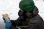 A serviceman in protective equipment analyzes a suspected chemical agent sample collected from the field. (Source: Public Affairs Officer of the Command of the Support Forces Lt. Col. Maksym Kravchuk)