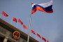 The Russian national flag fluters in front of the Great Hall of the People before a welcoming ceremony for Russian Prime Minister Mikhail Mishustin in Beijing on May 24, 2023. (Source: Getty Images)