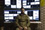 Commander of the battalion of unmanned aerial systems ‘Achilles’ Yurii Fedorenko sits near monitors at the command and observation post on March 19, 2024 in Chasiv Yar, Ukraine. (Source: Getty Images)