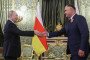 Russian leader Vladimir Putin and former leader of South Ossetia region Alan Gagloev. (Source: Getty Images)
