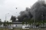 A firefighting helicopter is carrying water as black smoke billows from the area of Gazprom Neftâs Moscow oil refinery, located on the southeastern outskirts of Moscow, on June 18, 2026. (Source: Getty Images)