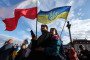 People gather to celebrate the Independence Day of Ukraine at Castle Square in Warsaw, Poland, on August 24, 2025. (Source: Getty Images)
