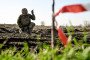 A sapper from the 808th Pontoon-Bridge Brigade searches for explosive ordnance in the deoccupied territory of the Kherson region, Ukraine, on November 22, 2025. (Source: Getty Images)