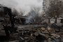 A man looks through debris at the site of a recent Russian air attack in front of a damaged residential apartment building in Zaporizhzhia on March 18, 2026. (Source: Getty Images)