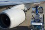 Employees stand on a fuel truck as they refuel an All Nippon Airways Co. (ANA) aircraft at Haneda Airport in Tokyo, Japan. (Source: Getty Images)