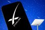 The SpaceX Starlink logo is seen displayed on a smartphone screen, with a Starlink satellite dish visible in the background. Illustrative Image. (Source: Getty Images)