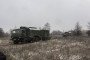 Russian R-330Zh “Zhitel” electronic warfare system mounted on a KamAZ military truck moving through a field during a deployment exercise. (Photo: Open sources)