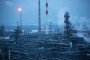 Chimneys, center, stand beyond petroleum cracking towers at the Lukoil-Nizhegorodnefteorgsintez oil refinery, operated by OAO Lukoil, in Nizhny Novgorod, Russia. (Source: Getty Images)