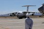 A man looks on as an Ilyushin Il-76 aircraft carrying supplies from the United Arab Emirates taxies at the Port Sudan airport, on May 5, 2023. (Source: Getty Images)