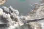 Explosion tears through a bridge structure during a Ukrainian drone strike, with debris and smoke rising over a river crossing. (Photo: Open source)
