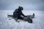 A Ukrainian emergency worker inspects the wreckage of a downed Russian Shahed-type drone in the Chernihiv region. (Source: DSNS Chernihiv)