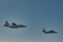 Two Ukrainian Air Force Su-25 attack aircraft fly during a combat mission over an undisclosed location in Ukraine. Illustrative photo. (Source: Libkos / Getty Images)