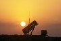 Patriot anti-missile missiles are aimed skyward at a base near the Iraqi border where Delta Battery of the Army’s 11th Air Defense Artillery Brigade is stationed, 2003.