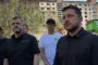 Zelenskyy arrives at the site of the strike in Kyiv's Darnytskyi district. (Source: Screenshot from "Novyny. Live" video)