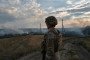 A soldier looks at a fire caused by artillery fire on July 29, 2024 in Donetsk region, Ukraine. (Source: Getty Images)