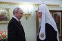 Russia’s leader Vladimir Putin congratulates Russia’s Orthodox Patriarch Kirill on his name day, in Moscow on May 24, 2026. (Source: Getty Images)