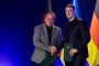 Ukraine's Defense Minister Mykhailo Fedorov shakes hands with Germany's Defense Minister Boris Pistorius after signing a letter of intent on cooperation in the field of defense technology and innovation in Kyiv on May 11, 2026. (Source: Getty Images)