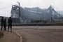 Passersby look at the burned-out warehouse of the logistics and trading company Wildberries in the Koledino industrial park, on August 17, 2026, in Podolsk, Russia. (Source: Getty Images)