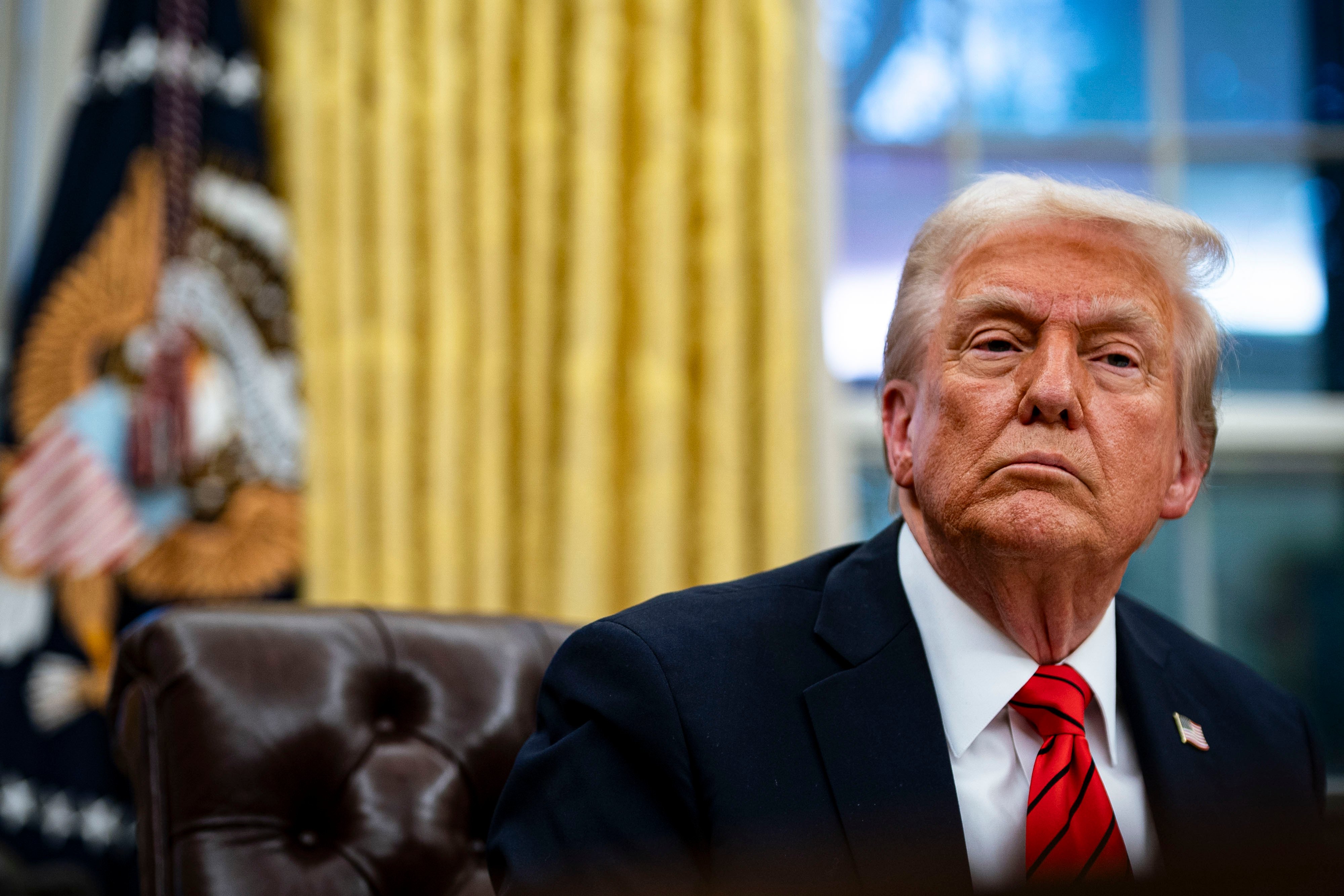 arafed president donald trump sitting in a chair in the oval room